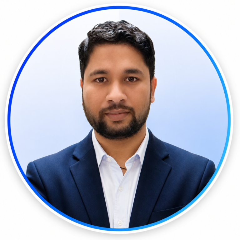 Vineet Singh Negi, Founder of VSN Creatives, wearing a navy blue suit and white shirt in a professional business headshot.